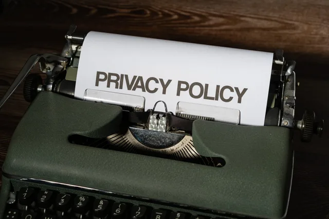 Close-up of a vintage typewriter with a sheet titled Privacy Policy. How to build a local SEO disclosure policy