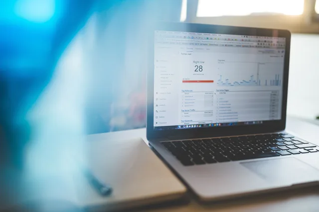 Laptop displaying Google Analytics in a modern workspace, highlighting digital analytics and technology. When to review local SEO return on investment figures