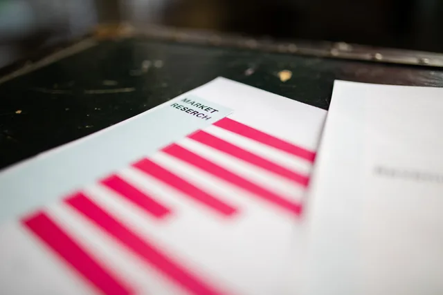 A detailed close-up of a market research document featuring a bar graph and a focus on market trends. Why local SEO survey tools need better source data